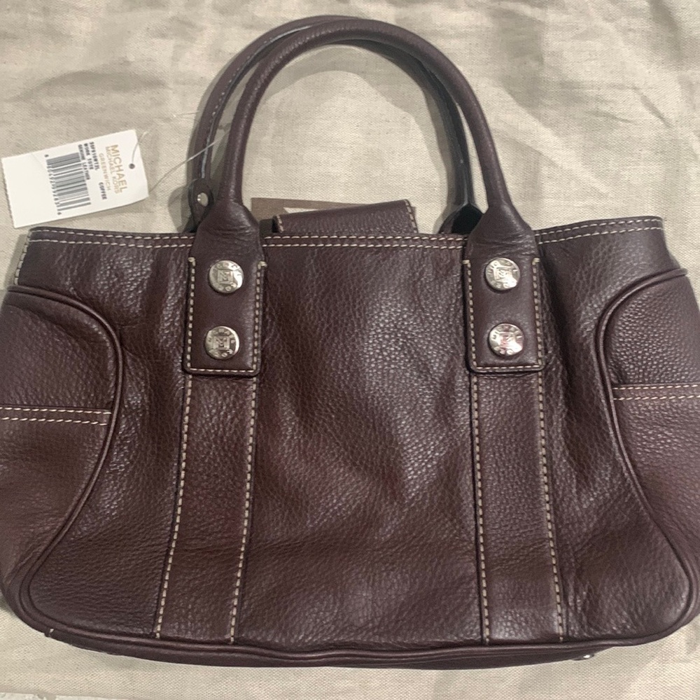 Michael Kors bag. coffee colored bag, style is work tote, genuine leather.
